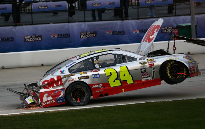 HAMPTON, GA - MARCH 01: The #24 3M Chevrolet of Jeff Gordon, is towed to the garage after an incident during the NASCAR Sprint Cup Series Folds of Honor QuikTrip 500 at Atlanta Motor Speedway on March 1, 2015 in Hampton, Georgia. (Photo by Kevin C. Cox/Getty Images)
